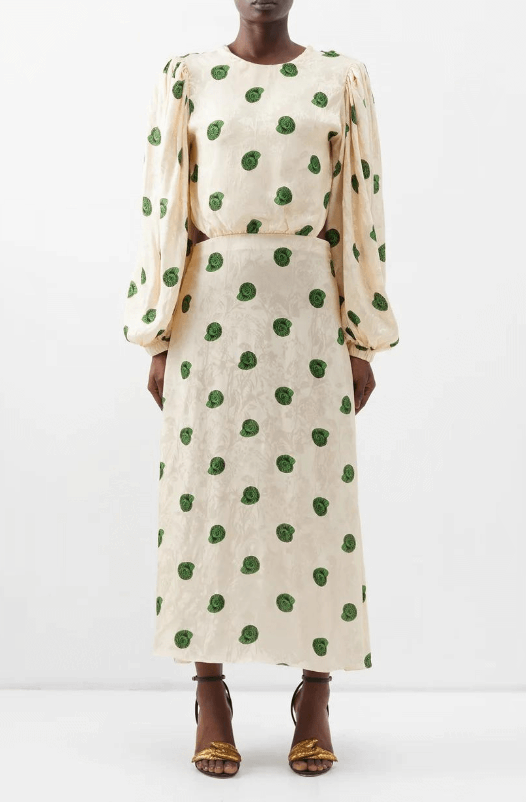 Model wearing Johanna Ortiz seashell print midi dress in a cream colour with an open back