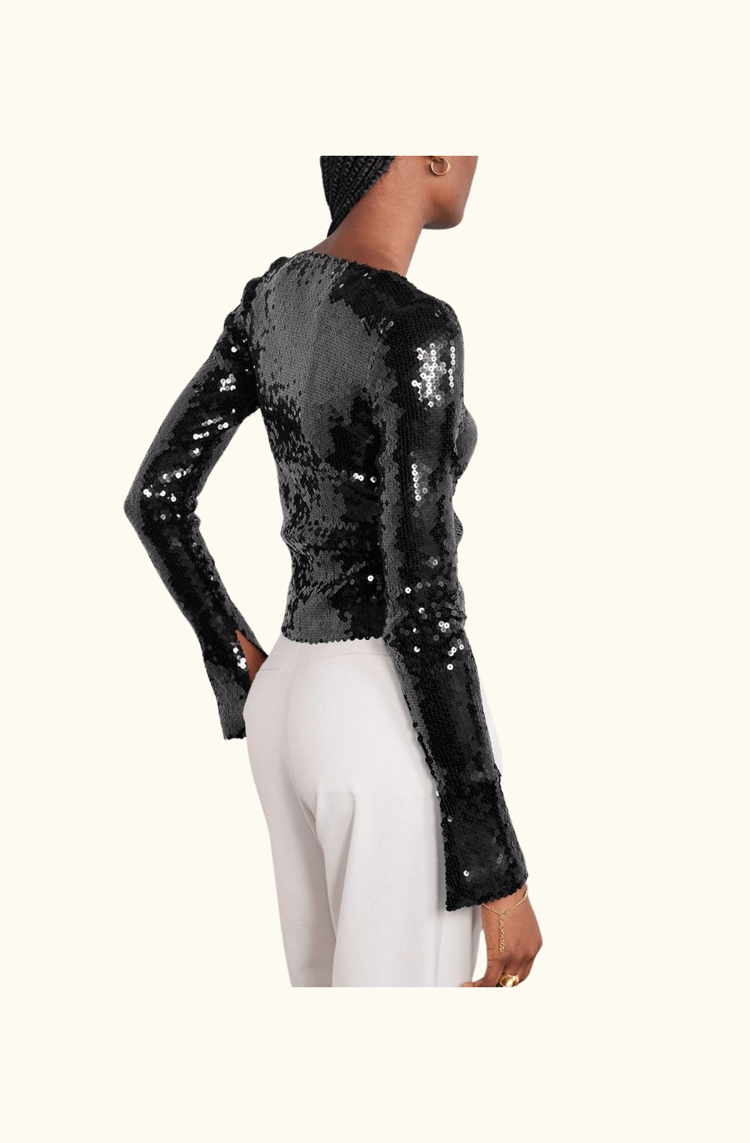 A black sequinned stretch-tulle top by 16Arlington, featuring long sleeves, a slightly cropped fit, and a plunging neckline with a metallic clasp detail.