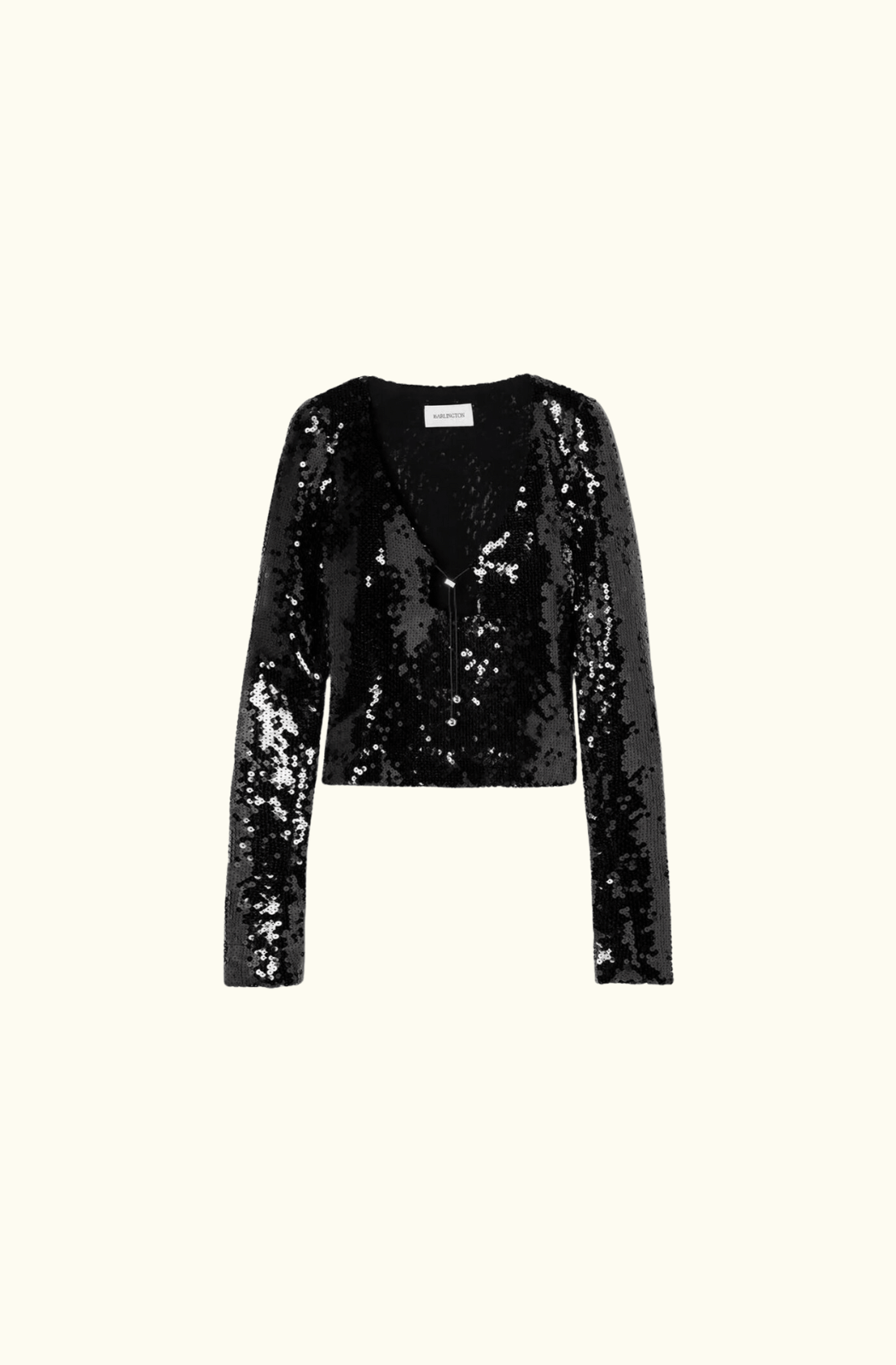 A black sequinned stretch-tulle top by 16Arlington, featuring long sleeves, a slightly cropped fit, and a plunging neckline with a metallic clasp detail, displayed on a plain white background.