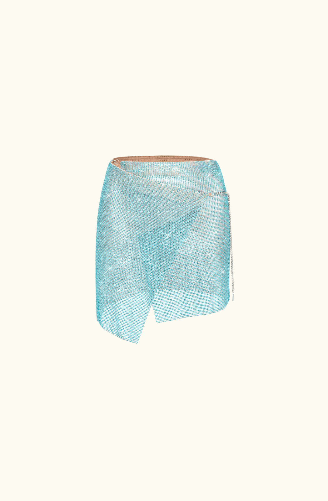 Plain background with the Poster Girl Winona Skirt in Crystallised Cerulean - a shimmering, asymmetrical mini wrap skirt made from rhinestoned micro metal-mesh.