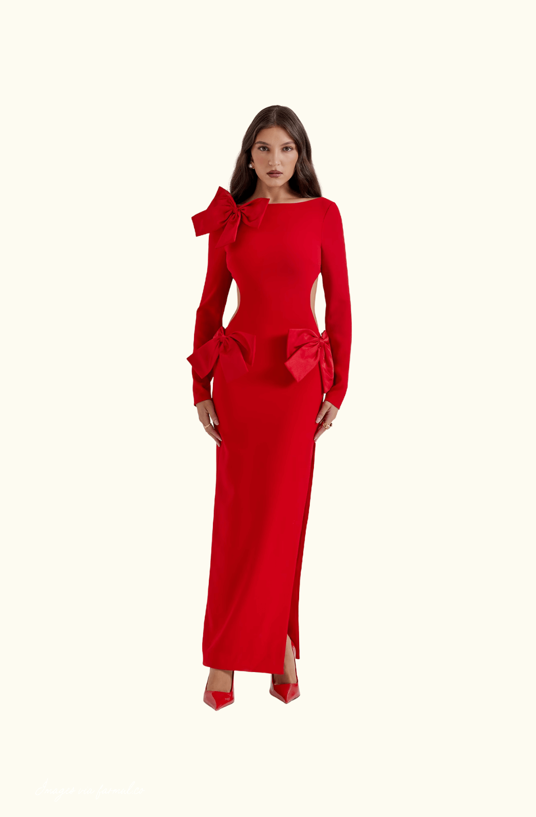 Model wearing the House of CB Lavele Red Bow Maxi Dress in red, showing fitted silhouette and thigh-high slit.
