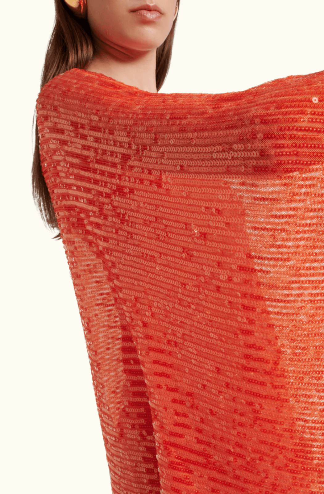 Close-up of the orange sequined fabric on the Spritz Disco dress, showcasing texture and shine.