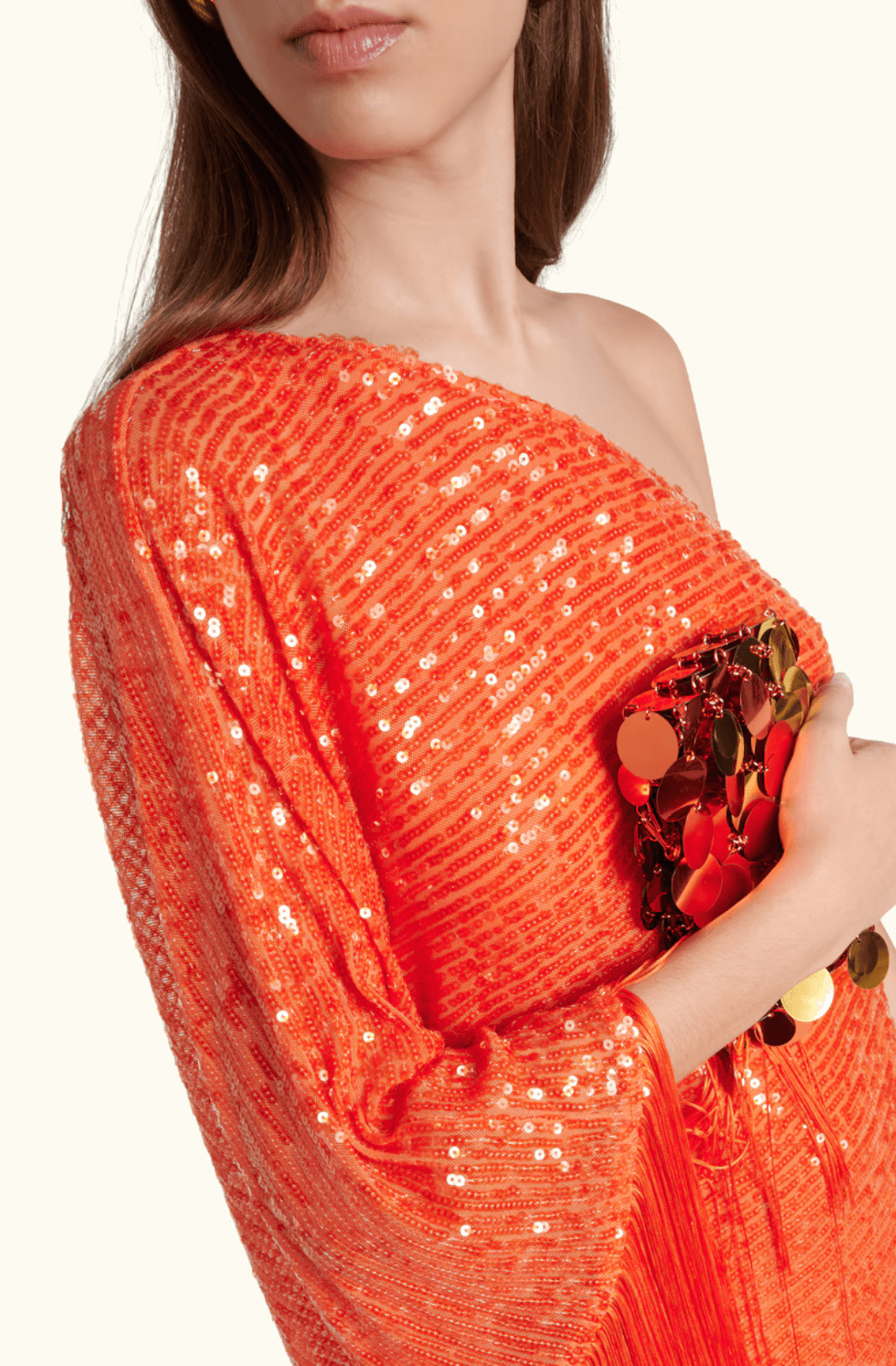 Back view of the orange sequined Taller Marmo dress with cape detailing and concealed zip closure.