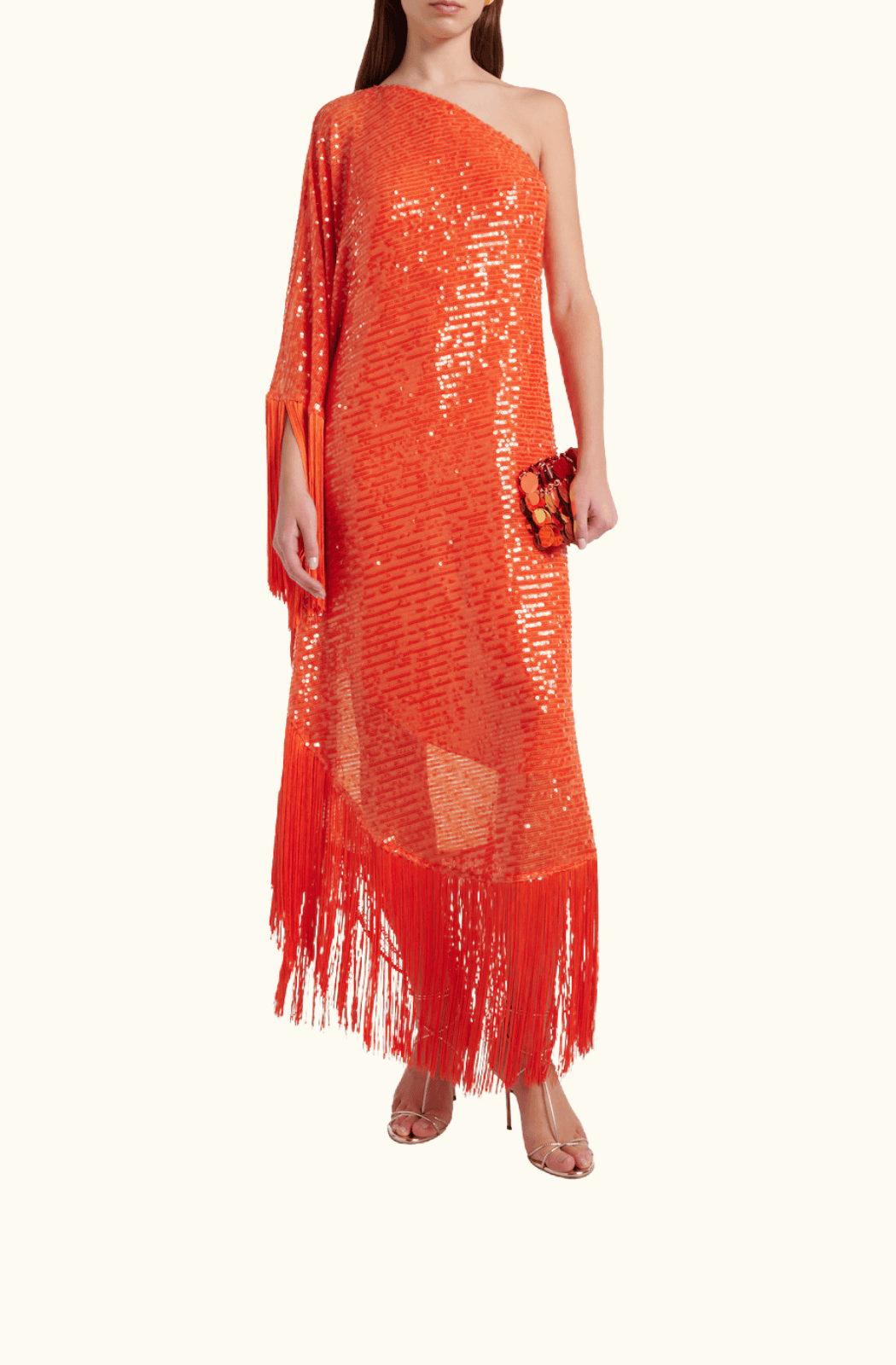 Model in motion wearing the Spritz Disco Maxi Dress, capturing flow of cape sleeves and sequin shimmer.