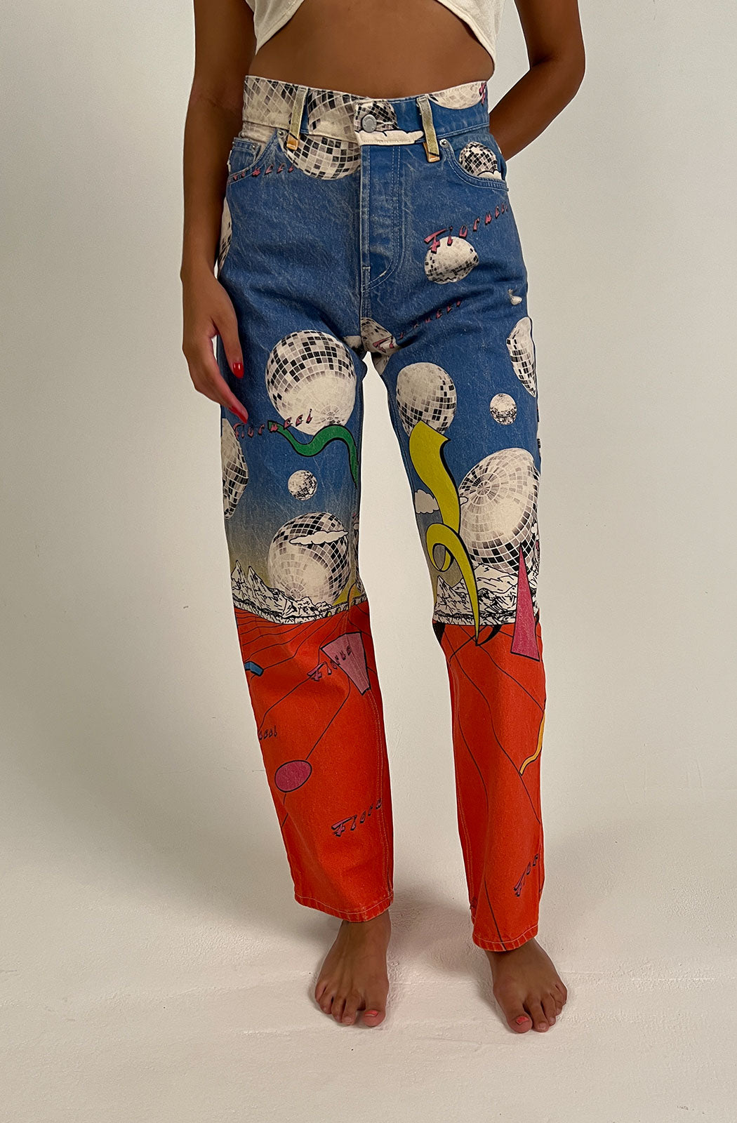Women's Discoteca Jeans in the all-over multi-coloured discoteca print from the archive. The graphic jeans are high-waisted with a straight leg fit, iconic 5-pocket design, waistband with belt loop and a button and zip fly. Made from hand-crafted, incredibly flattering premium denim. Close up