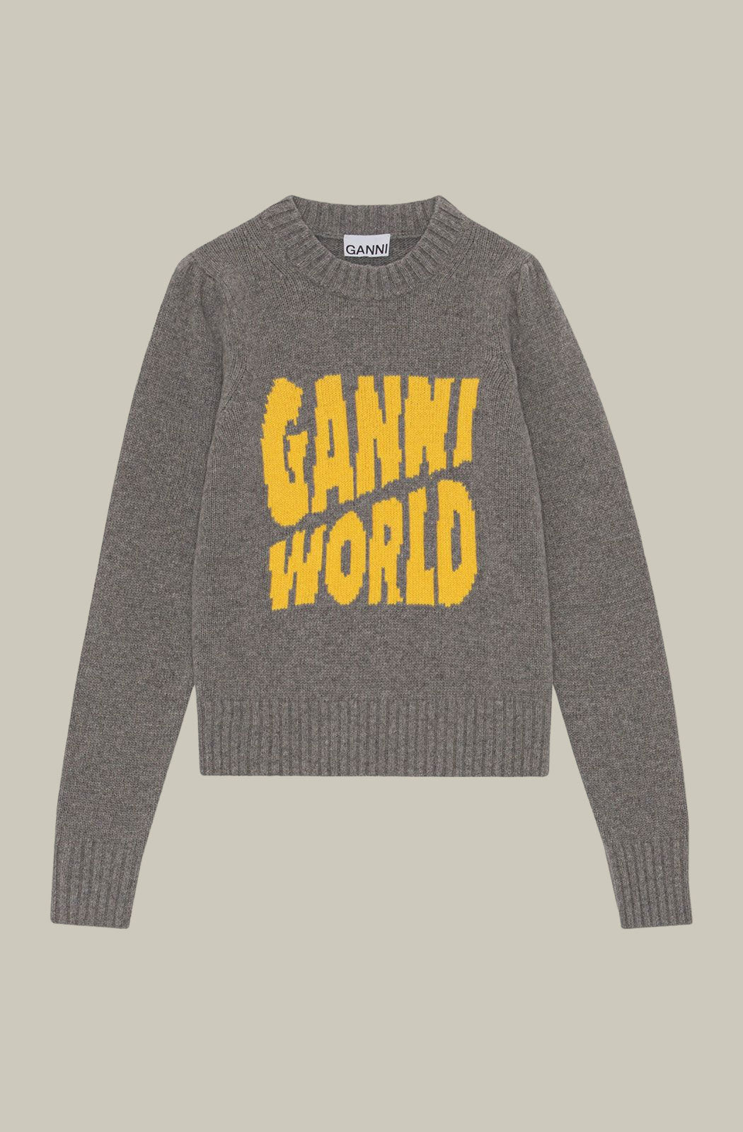 Graphic Pullover by Ganni it's made from a blend of certified recycled wool. The pullover is designed for a straight fit and features a round neckline, puff shoulders, GANNI world graphic and ribbed edges.